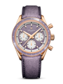 Rose gold chronograph watch with purple dial, three white subdials, tachymeter bezel, and purple fabric strap.