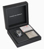 Porsche Design watch in a black box with a white background