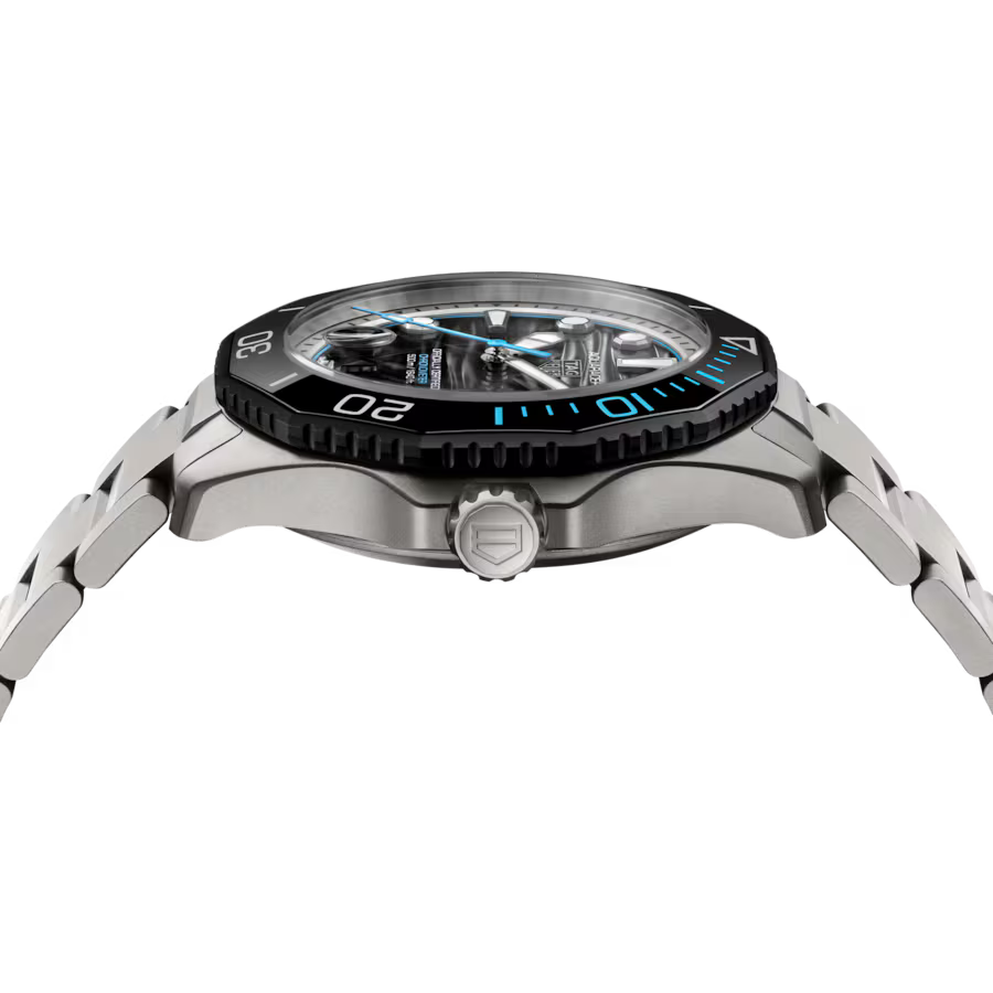 Stainless steel sports watch with black and blue bezel, black dial, and metal bracelet displayed at angle.