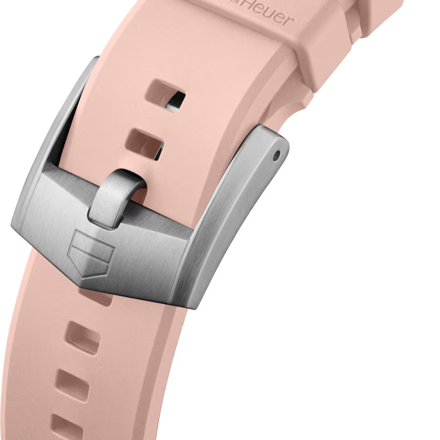 Close-up of a pink watch strap with a silver buckle on a white background