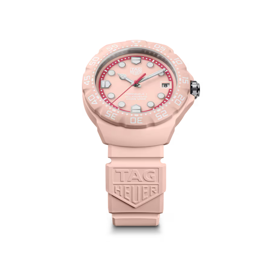 Pink TAG Heuer watch with red dial on a white background