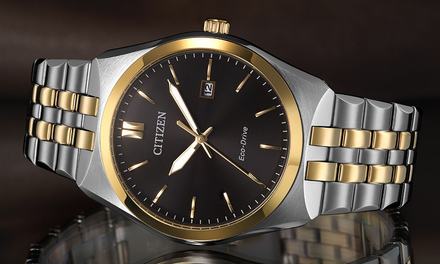 Citizen watch with silver and gold band on a reflective surface