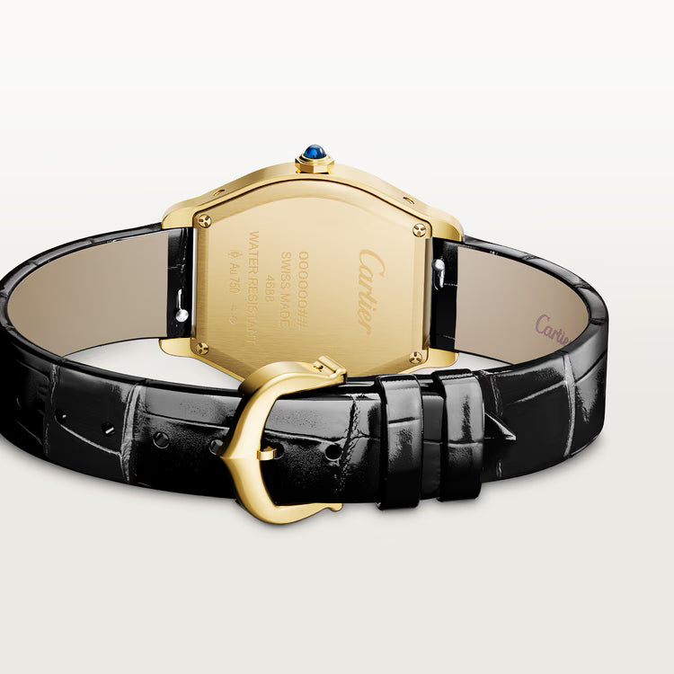 Gold-tone tonneau watch with black leather crocodile-textured strap and blue gemstone crown.