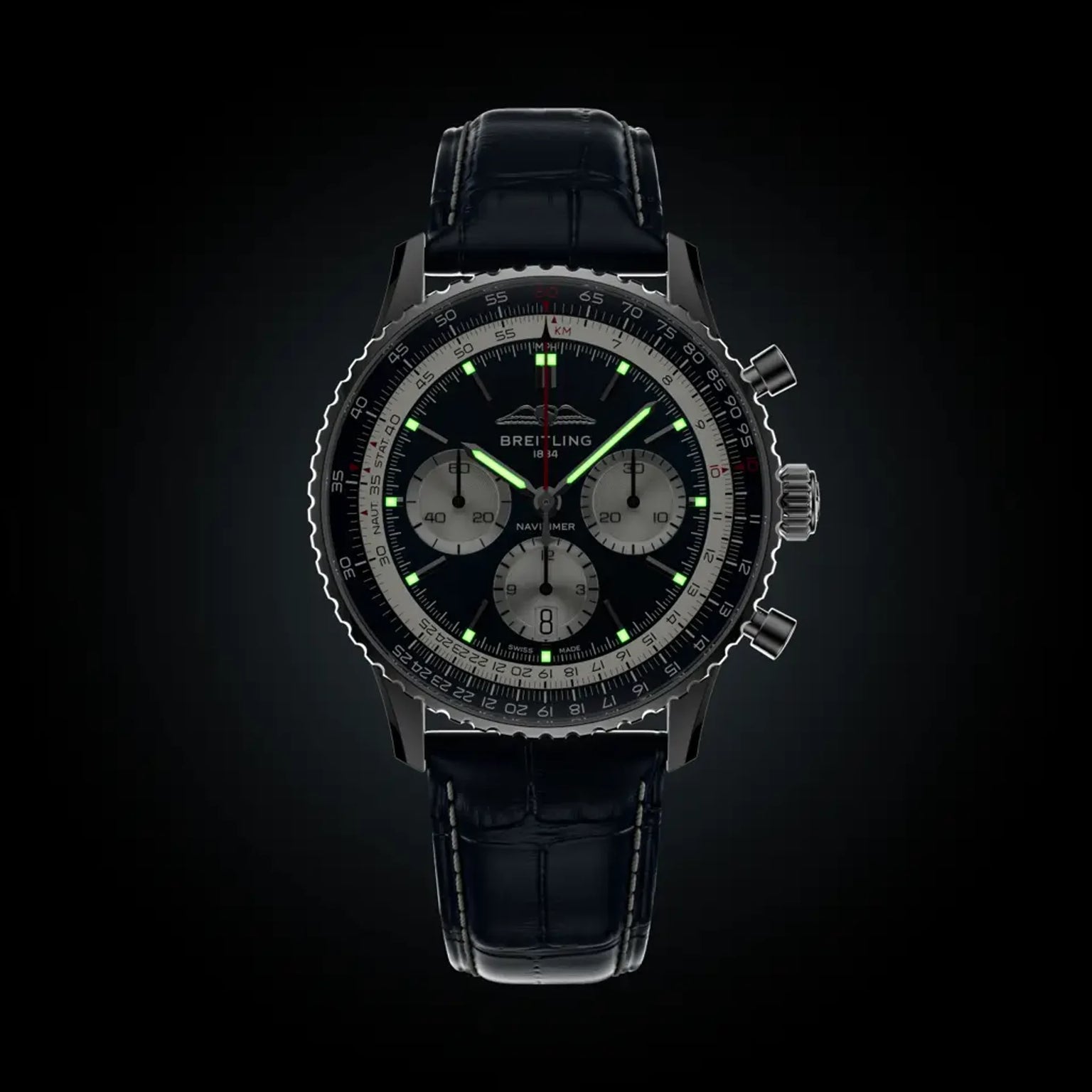 Black Breitling watch with detailed face on a black background