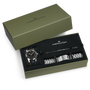 The Hamilton Khaki Field Murph Auto gift set includes a watch, metal bracelet, and tool, all presented in a green box.