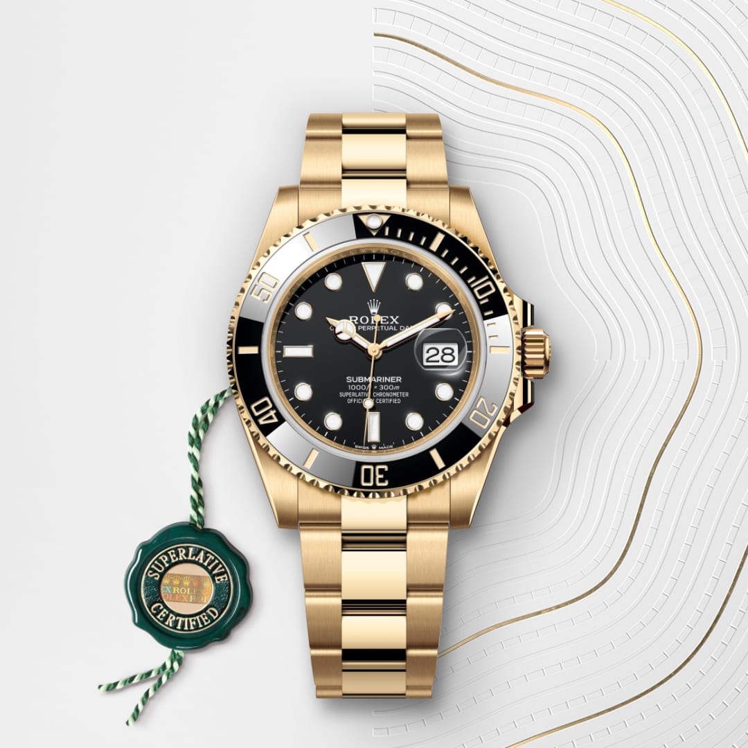 Gold Rolex Submariner watch with black dial and bezel, date display, and Superlative Certified tag.