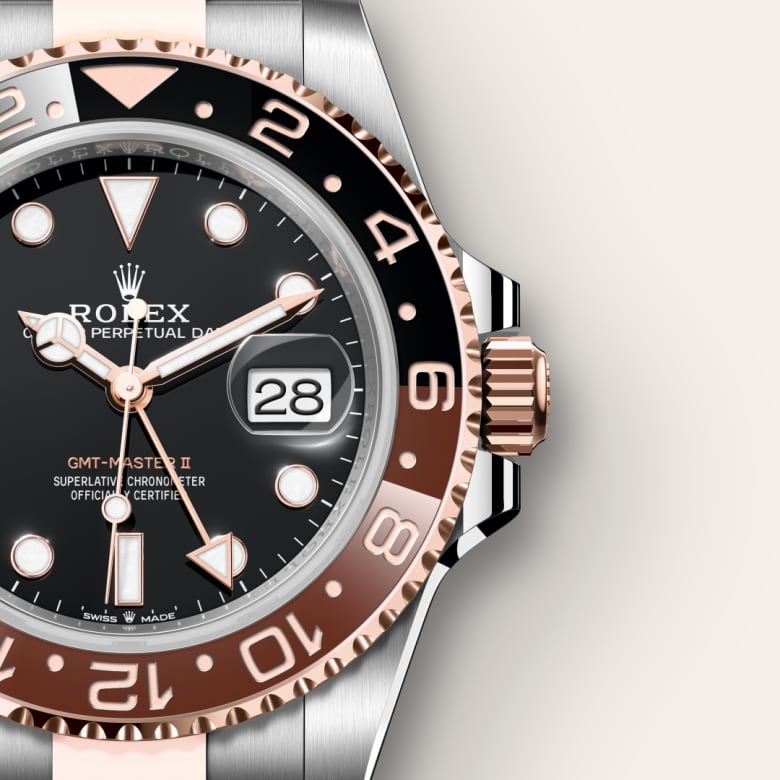 Close-up of a Rolex GMT-Master II watch showing the black dial, date display, and two-tone bezel.