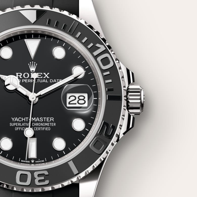 Close-up of a Rolex Yacht-Master watch face showing the date and black bezel with white markers.