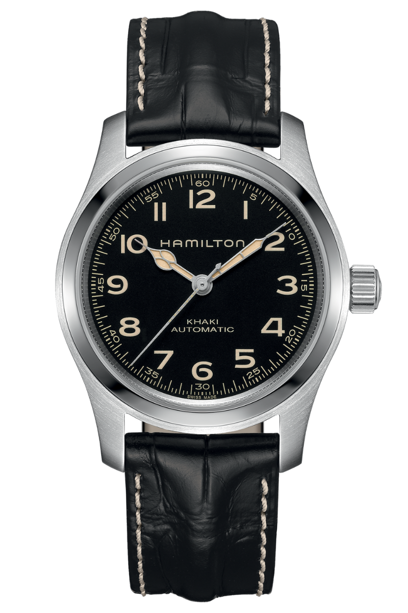 The Hamilton Khaki Field Murph Auto features a black dial with beige numerals and a black leather strap with white stitching.