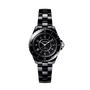 The Chanel J12 wristwatch features a round black ceramic and steel case, Arabic numerals, and a polished link bracelet, shown against a plain white background.