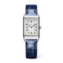 The Jaeger-LeCoultre Reverso Classic Monoface is a rectangular stainless steel watch with a white dial, blue hands, black Arabic numerals, a textured blue leather strap, and precise quartz movement.