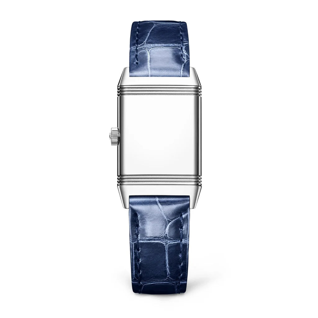 The Jaeger-LeCoultre Reverso Classic Monoface is a rectangular stainless steel watch with a plain face and textured blue leather strap, shown upright against a white background.