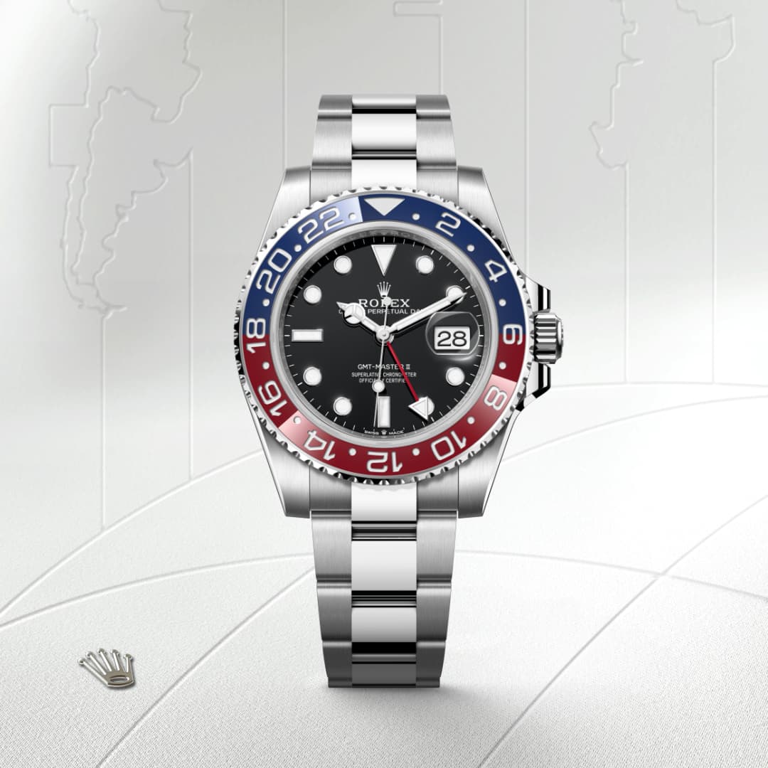 A Rolex GMT-Master II watch with a blue and red bezel, black dial, and silver bracelet on a map background.