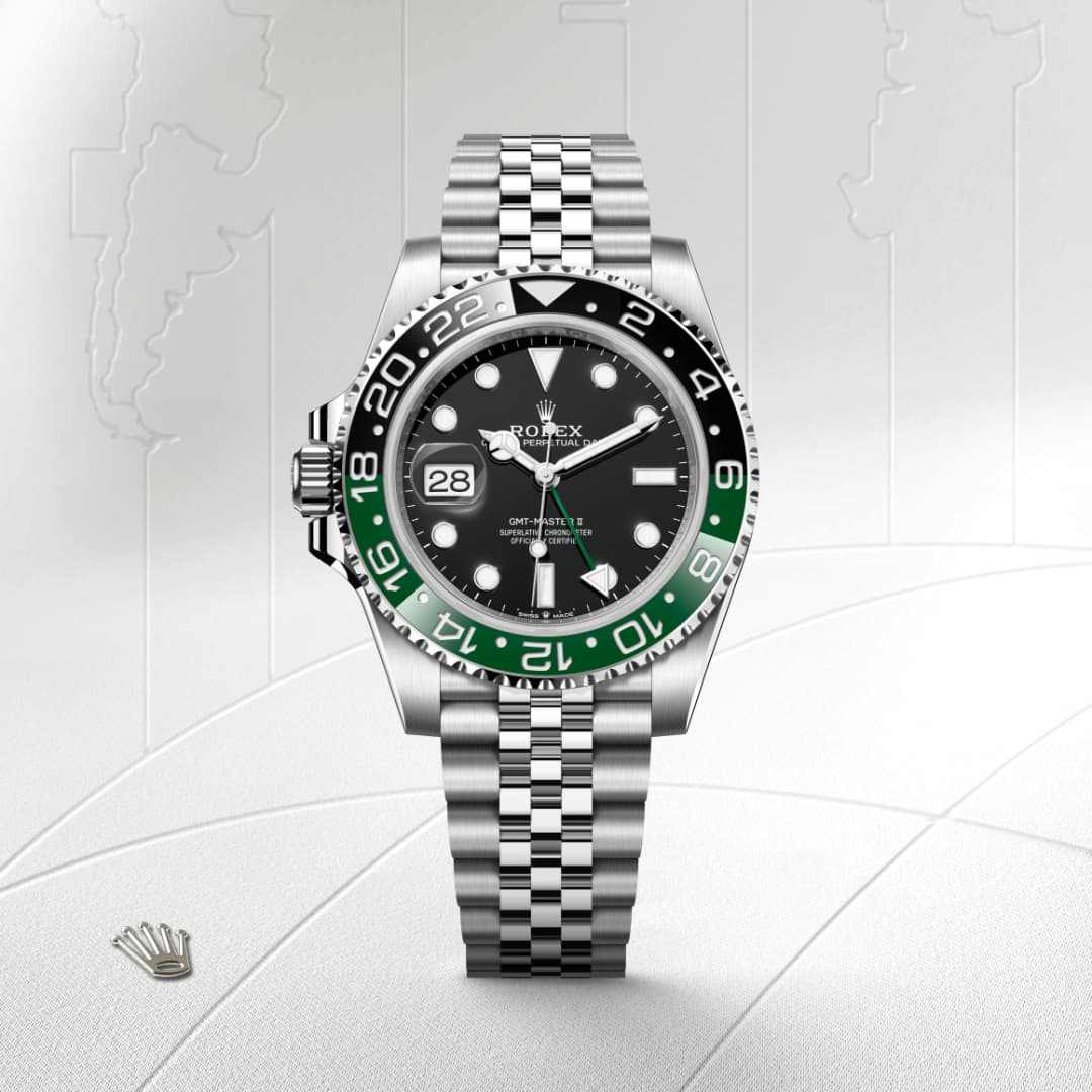A Rolex GMT-Master II watch with a green and black bezel and silver metal bracelet displayed on a white background.