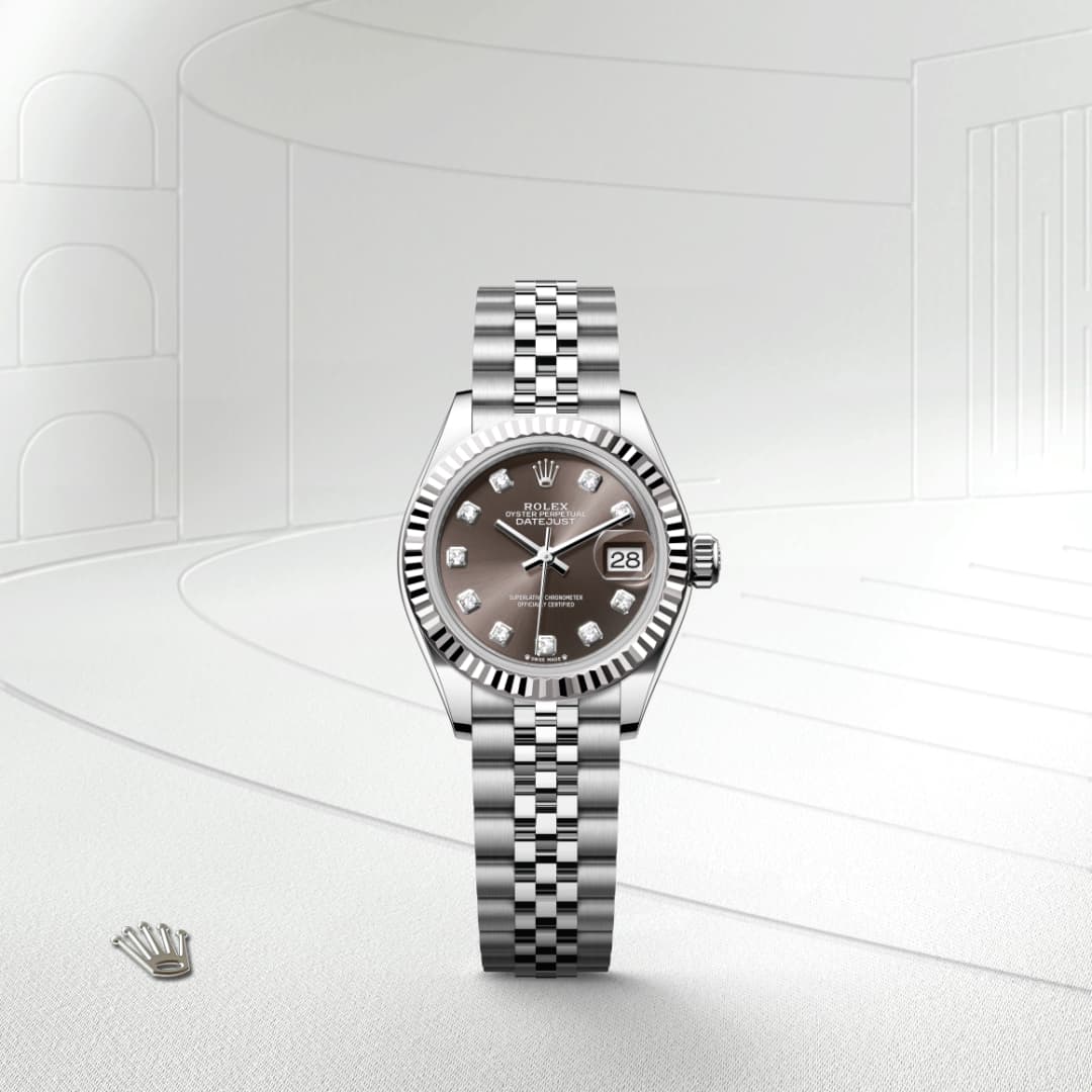 A Rolex watch with a silver band and diamond hour markers displayed on a light, modern background.