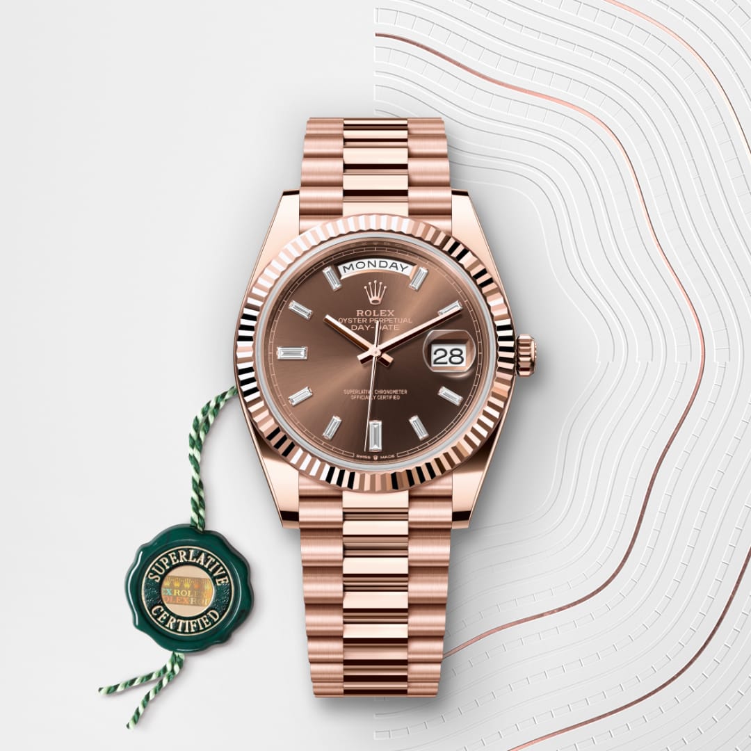 A rose gold Rolex watch with a brown dial, date display, and green Superlative Certified tag on a patterned background.