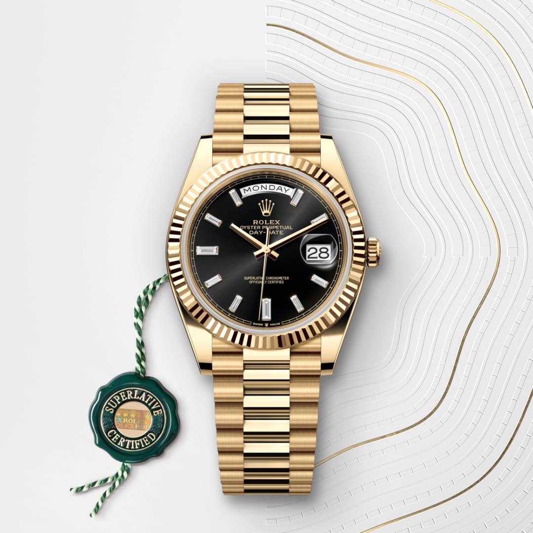 Gold Rolex Day-Date watch with black dial, date display, and Superlative Certified tag on a patterned background.