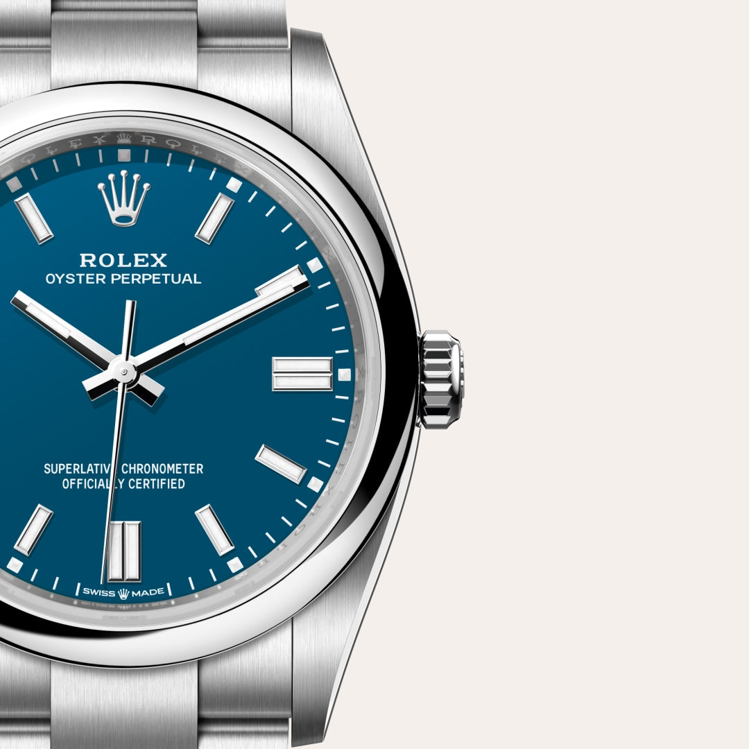 Close-up of a Rolex Oyster Perpetual watch with a blue dial and stainless steel case and bracelet.