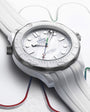 White Omega watch with detailed face and strap on a light background