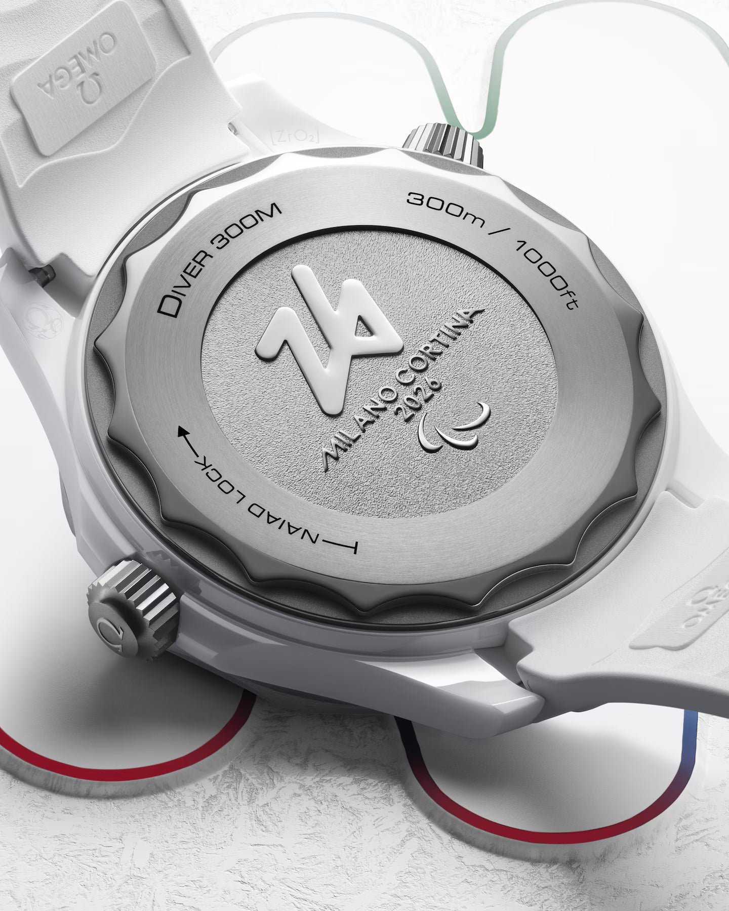 Close-up of a watch case with brand logo on a light background