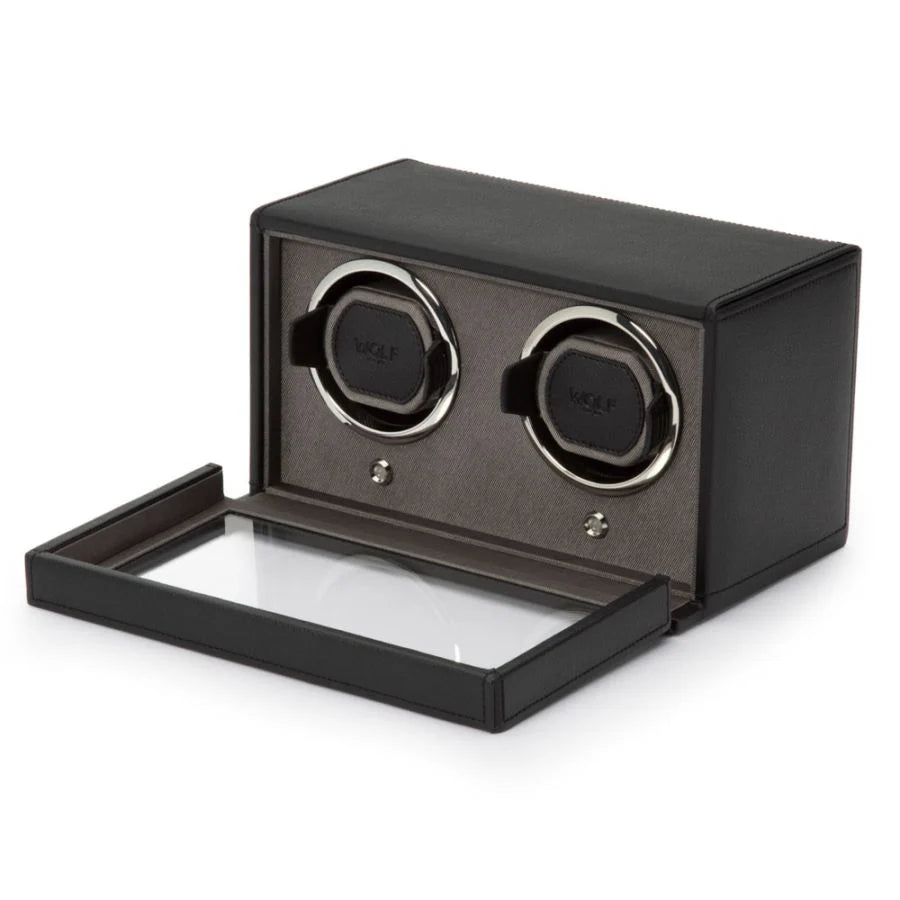 Black leather watch winder with two rotating watch cups, open drawer base, and removable top cover.