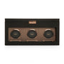 Black watch winder box with three rotating watch holders and rose gold accents.