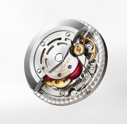 Close-up of a Rolex watch mechanism on a white background