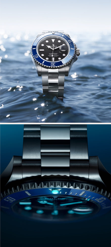 Silver and blue wristwatch with a black dial shown above water and in a close-up, both under bright light.