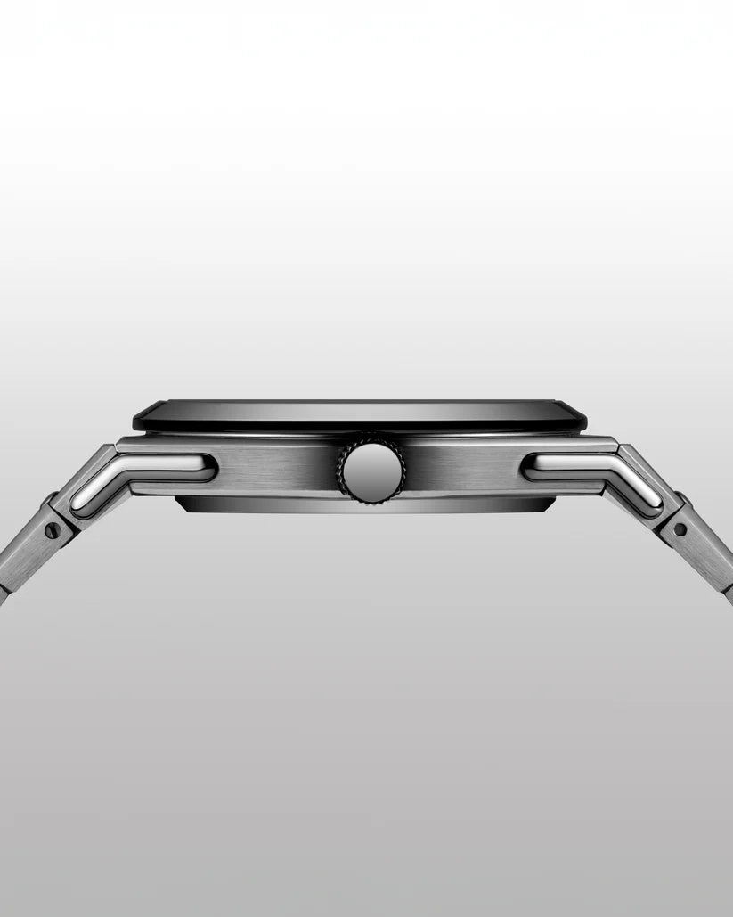 Close-up of a silver smartwatch on a light gray background