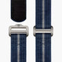 Two blue woven straps with metal buckles on a white background