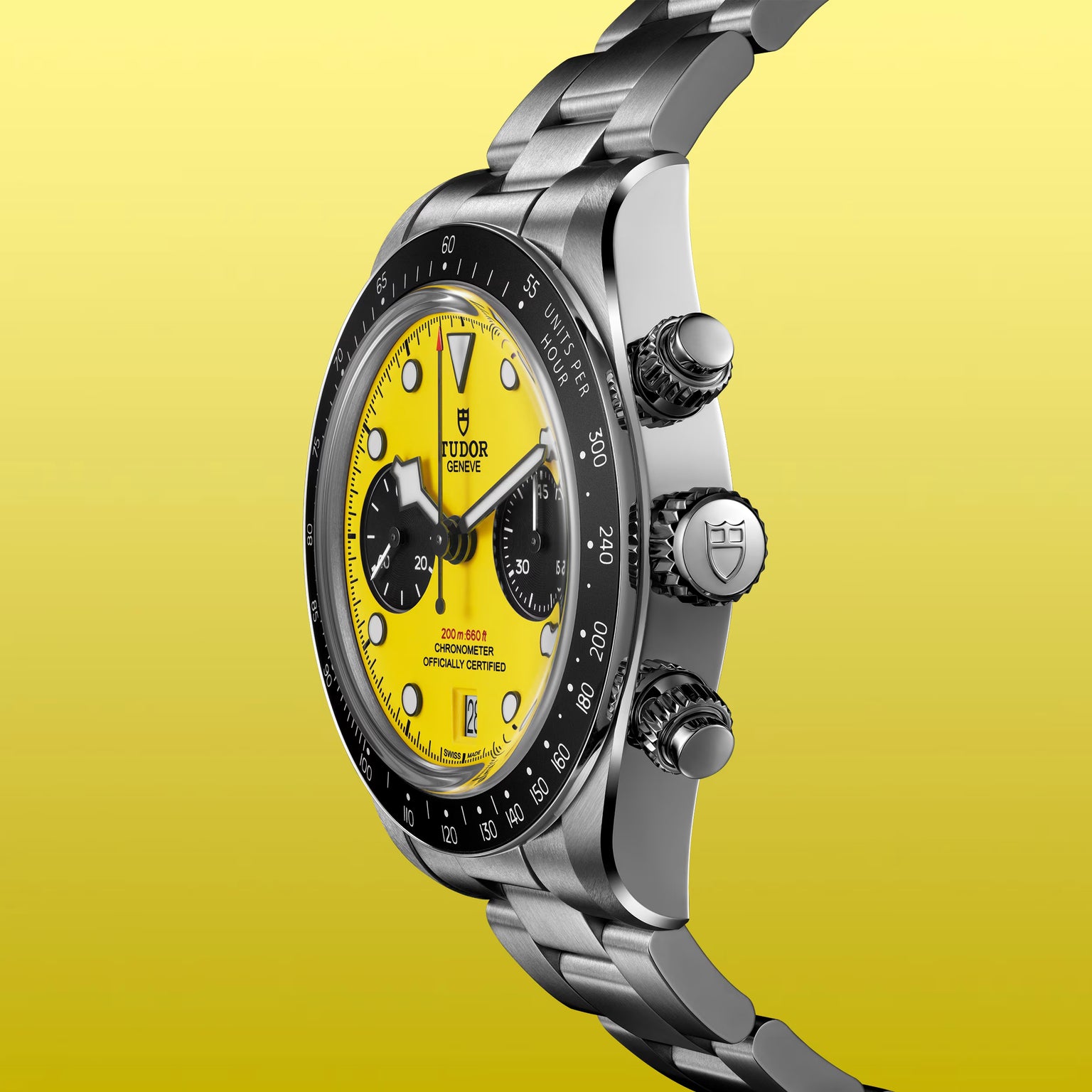 Tudor Black Bay Chrono stainless steel watch with yellow dial, black subdials, and tachymetric bezel.