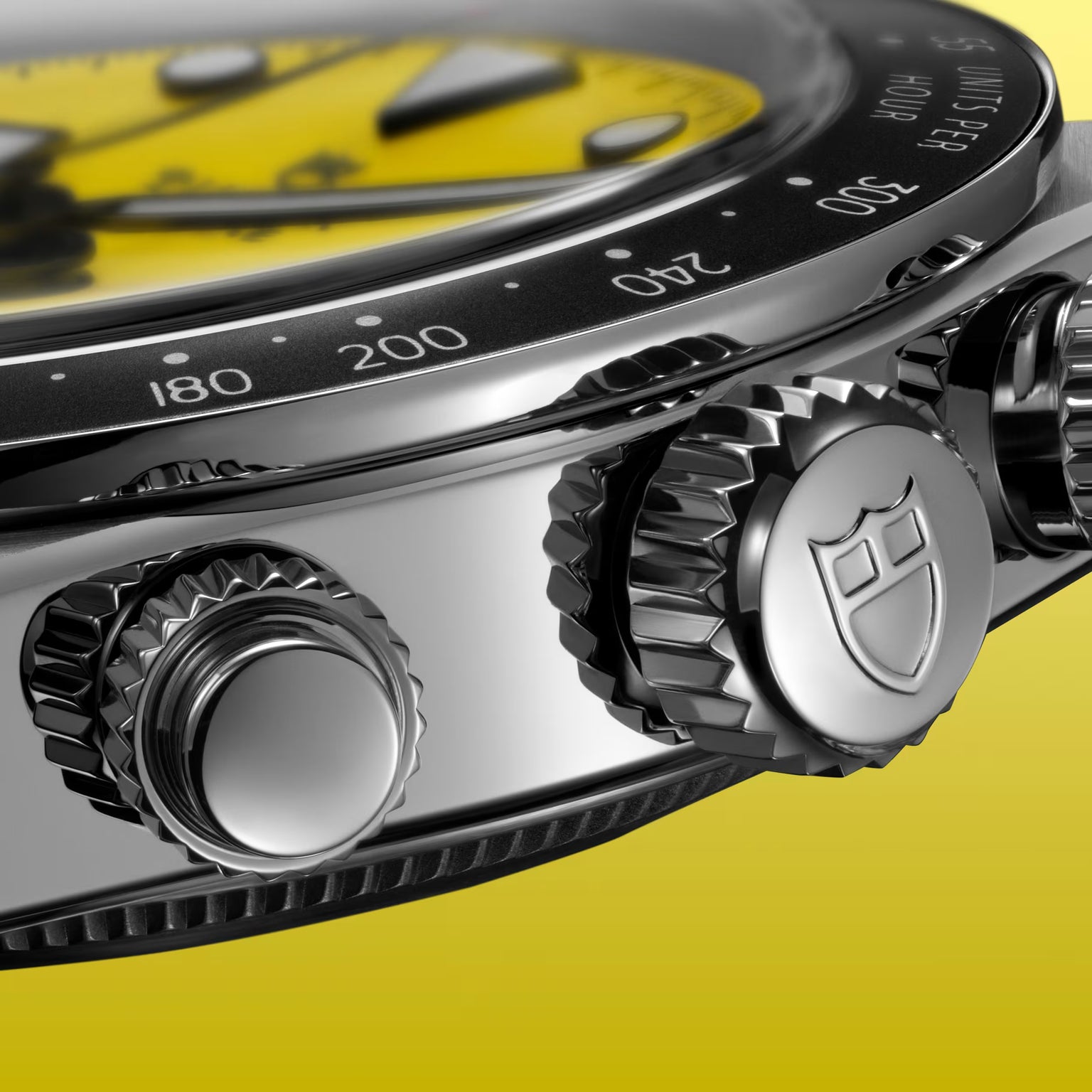 Black Bay Chrono chronograph watch with yellow dial, black bezel, steel case, and textured pushers.