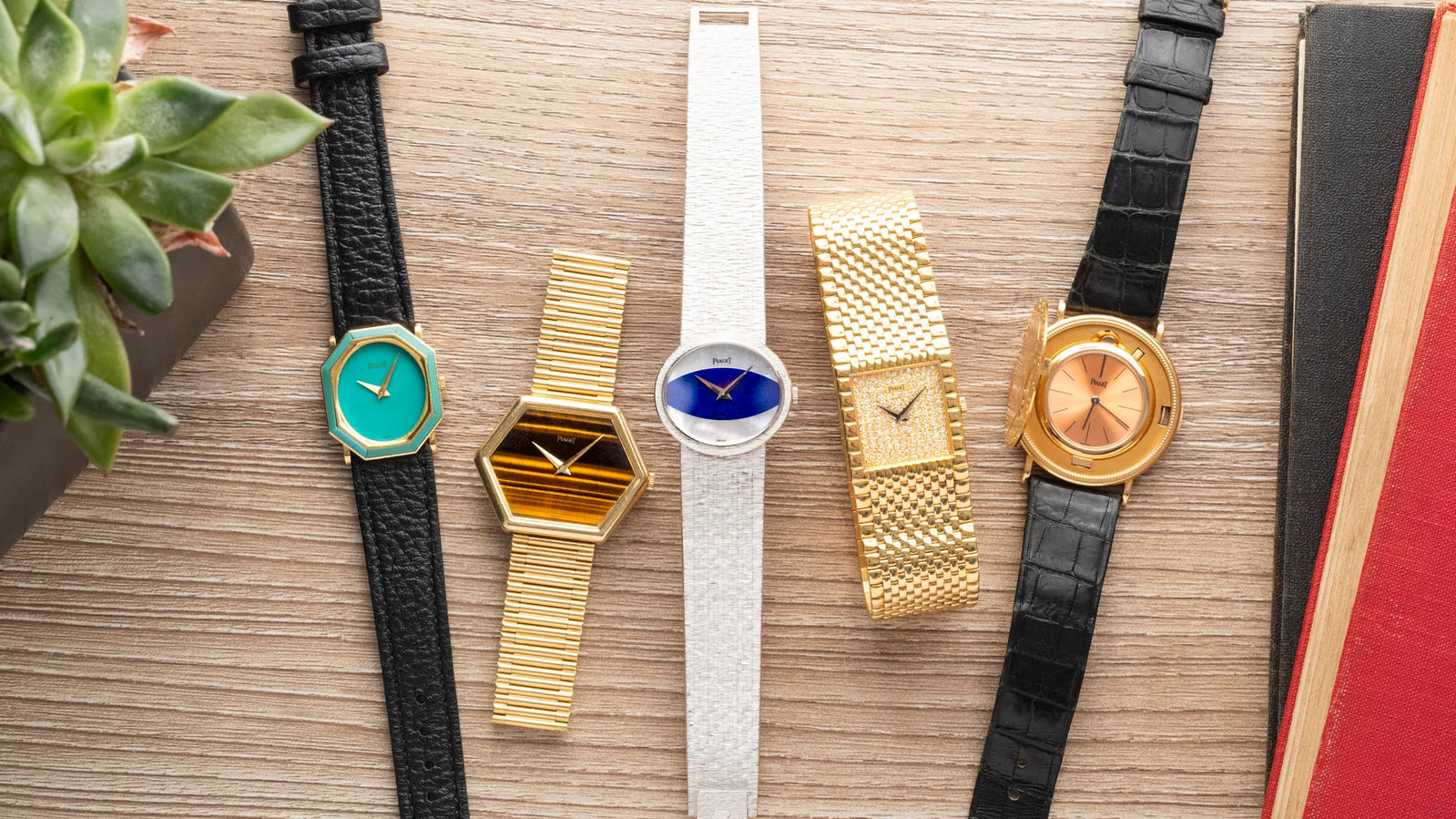 Five vintage wristwatches with different colored faces and bands are arranged side by side on a wooden surface.